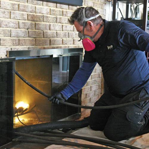 Chimney sweeping service in progress